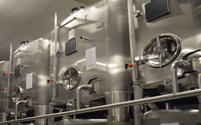 a large metal tanks with pipes and valves